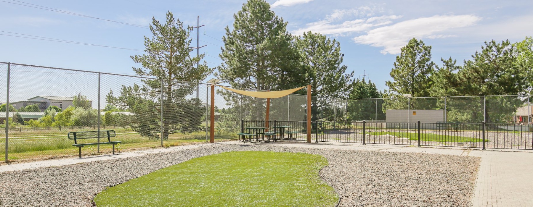 Dog park with green space and gravel