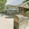 Grilling near pool with clubhouse in the back